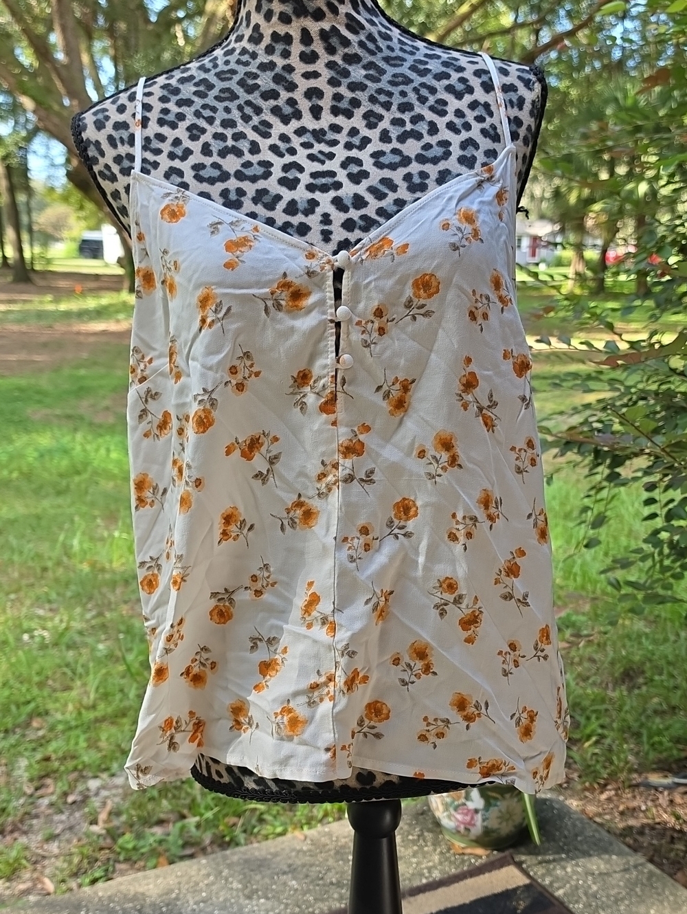 All in Favor. White Cami Top with Adorable Orange Floral Print.
